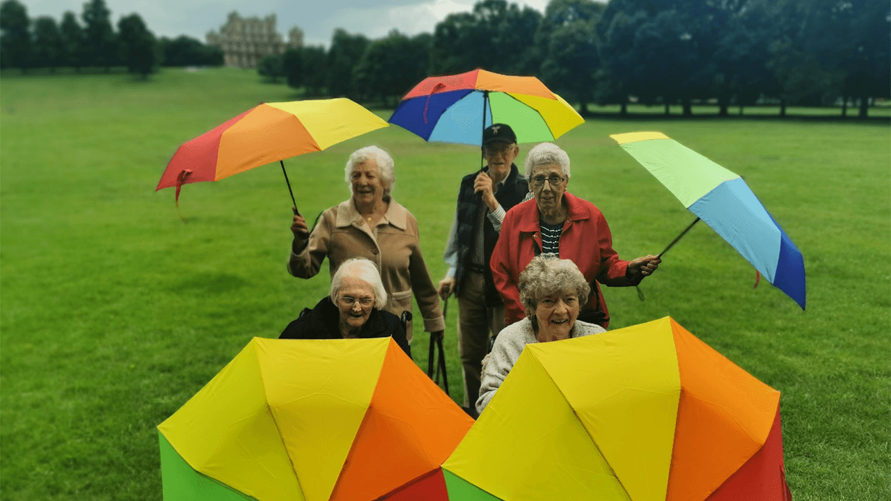 Acer Court Residents with Umbrellas