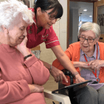 Astbury Manor resident and staff