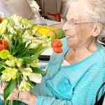 Avery Park resident with flowers